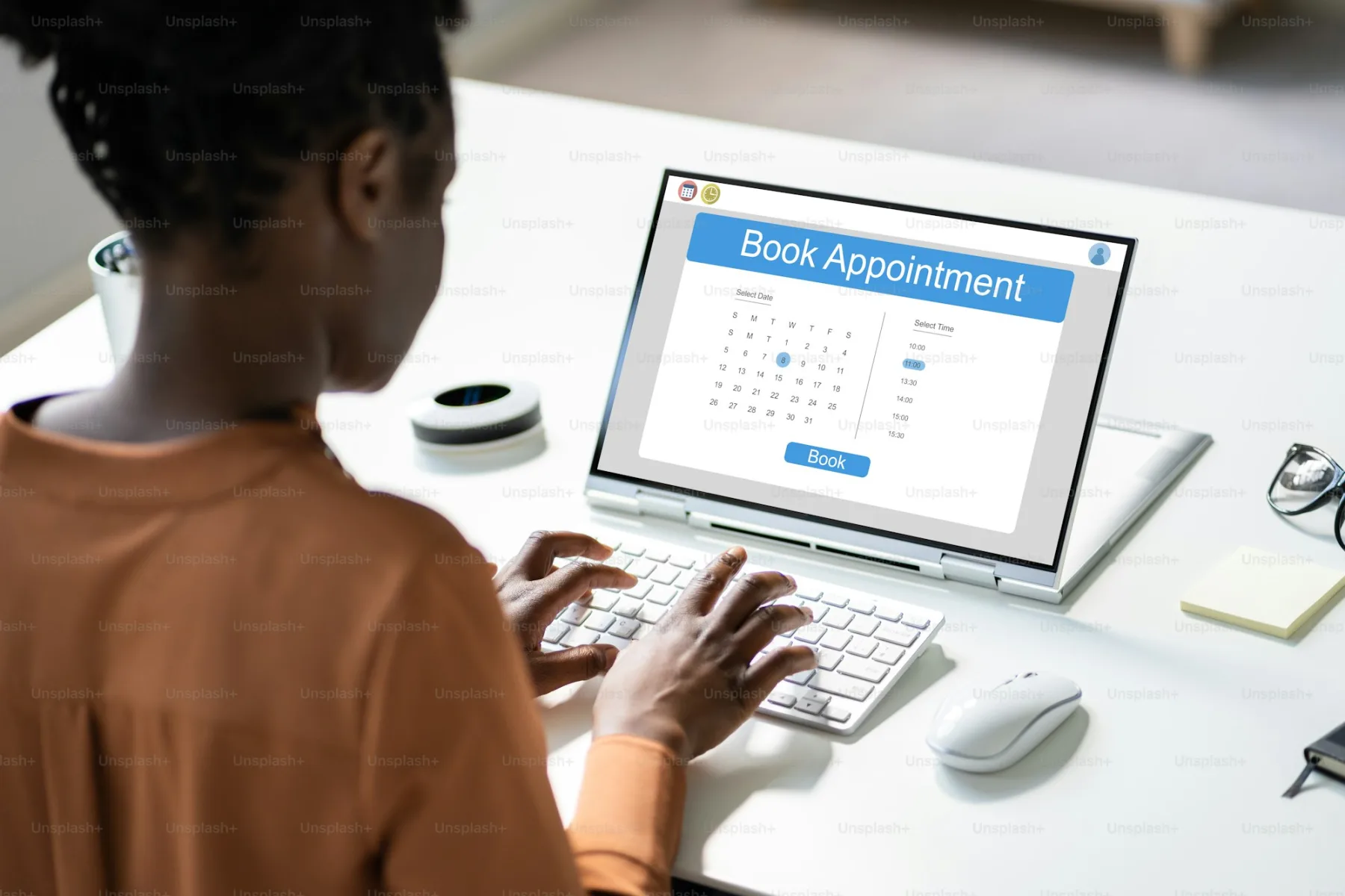A person schedules a consultation on a laptop calendar — modern law firm booking flow.