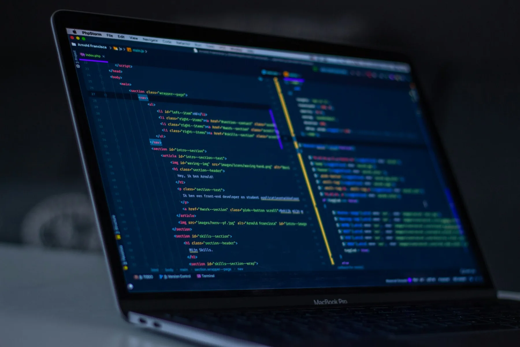 MacBook Pro displaying source code — modern web development.